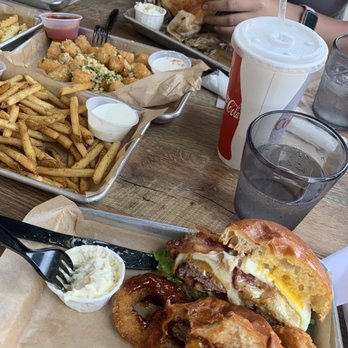 American Grub - Rosemary Fries, Garlic Tater Tots, half Guilty burger and Half BBQ burger. - Burgers Near Me - Tustin, California American Grub - Rosemary Fries, Garlic Tater Tots, half Guilty burger and Half BBQ burger. - Burgers Near Me - Tustin, California