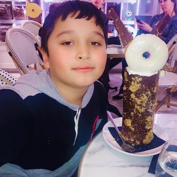 Sugar Factory Express - My son and his chocolate rocky road $18 - Desserts Near Me - Bloomington, Minnesota