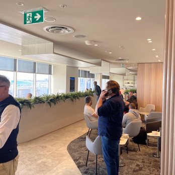 Plaza Premium Lounge - Patrons clearing the tables so they can sit down. - Airport Lounges Near Me - Mascot, NSW Plaza Premium Lounge - Patrons clearing the tables so they can sit down. - Airport Lounges Near Me - Mascot, NSW