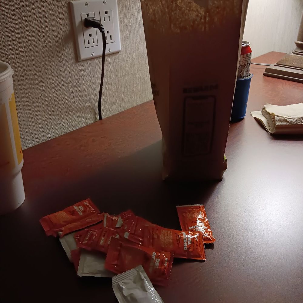 Del Taco - a bag of chips and a cup of coffee on a table - Fast Food Near Me - Gallup, New Mexico Del Taco - a bag of chips and a cup of coffee on a table - Fast Food Near Me - Gallup, New Mexico