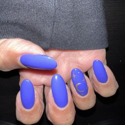 Le Nails - Gel manicure with the moon and star design.