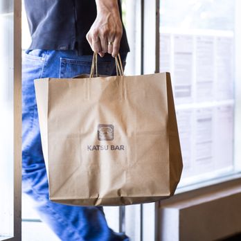 Katsu Bar - a man carrying a brown paper bag - Burgers Near Me - El Segundo, California