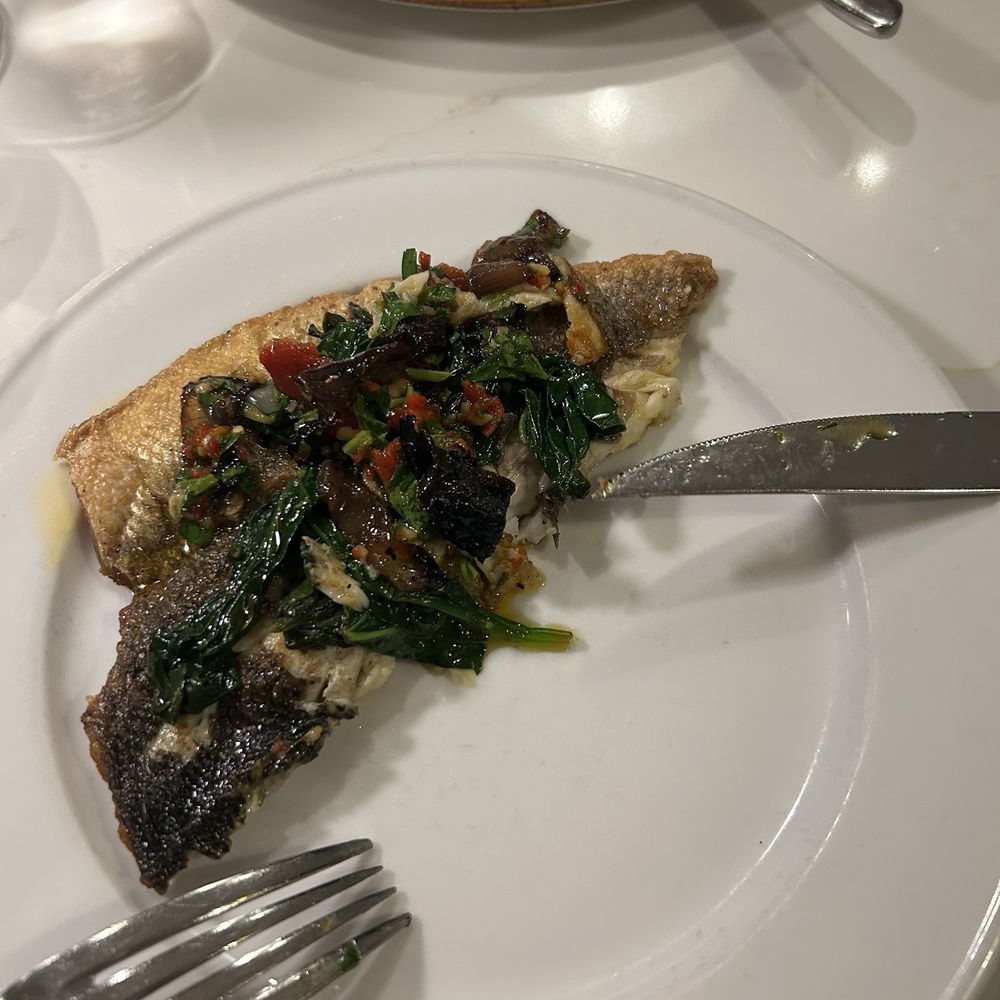 Seppia - Bronzino with sautéed spinach - Italian Near Me - Baltimore, Maryland Seppia - Bronzino with sautéed spinach - Italian Near Me - Baltimore, Maryland