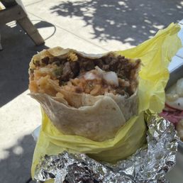 This is a big burrito for 10 dollars, the green chile is bomb to and there nachos are loaded and huge . This is a big burrito for 10 dollars, the green chile is bomb to and there nachos are loaded and huge .