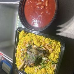 Besan's International Market - Lamb Shank with rice in beans in their menu showed a non base tomato sauce. It was a lighter broth sauce