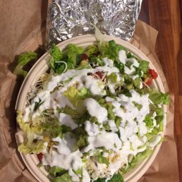 Chicken bowl with tortilla on the side in the foil wrap Chicken bowl with tortilla on the side in the foil wrap