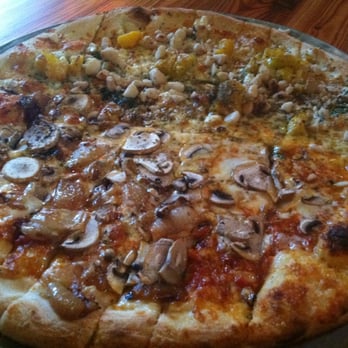 Flatbread Company - Half Kabocha squash and macadamia nuts and half Pa'ia Bay Ohana (mushrooms, mozzarella, and onions). - Pizza Near Me - Paia, Hawaii Flatbread Company - Half Kabocha squash and macadamia nuts and half Pa'ia Bay Ohana (mushrooms, mozzarella, and onions). - Pizza Near Me - Paia, Hawaii
