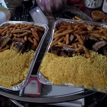 Brasas BBQ - wo trays of food on a table - Portuguese Near Me - Toms River, New Jersey Brasas BBQ - wo trays of food on a table - Portuguese Near Me - Toms River, New Jersey