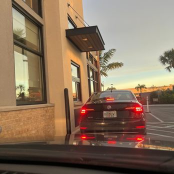 Raising Cane's Chicken Fingers - a car in a parking lot - New American Near Me - Boynton Beach, Florida Raising Cane's Chicken Fingers - a car in a parking lot - New American Near Me - Boynton Beach, Florida