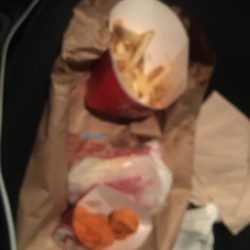 Wendy's - 4 PC. Spicy Chicken Nuggets, French Fries a spicy nuggets that I didn't order and some cold ass fries