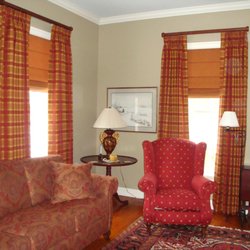 Best Dressed Windows In Town - Plaid drapes with roman shades on 2" wood rods