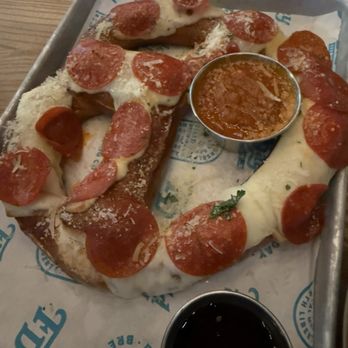 Field Day Brewing - Pizza pretzel with marinara and hot honey. So good! - Breweries Near Me - North Liberty, Iowa