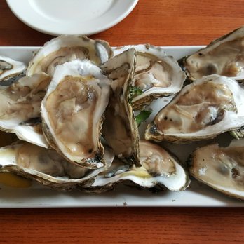 Red House - 50 cent oysters for happy hour - New American Near Me - Cambridge, Massachusetts Red House - 50 cent oysters for happy hour - New American Near Me - Cambridge, Massachusetts