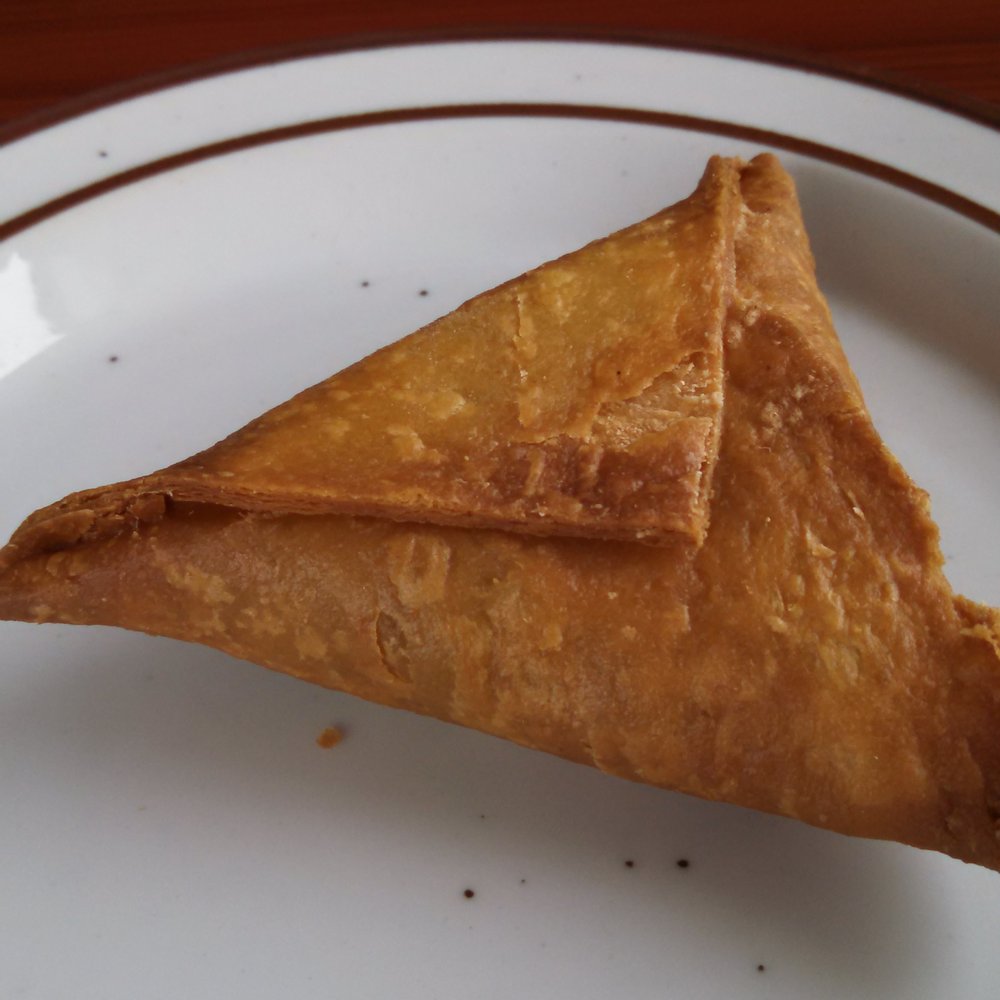 Fatima's Cafe - Meat Samosa, delicately seasoned, light and crunchy, perfect balance of flavors - African Near Me - Worcester, Massachusetts