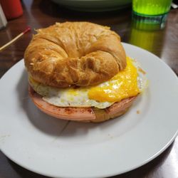 Mueller's Bistro & Bakery - Breakfast sandwich with fried bologna, fried egg and cheese on a croissant