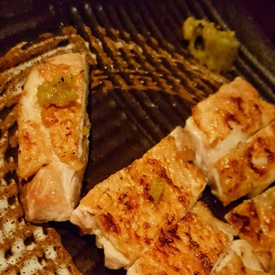 Photo of Yuzu - Torrance, CA, United States. Grilled chicken...crispy skin, tender juicy meat. The yuzu pepper adds a nice bite...the squeeze of lemon adds a great extra dimension.