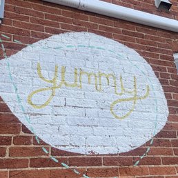 a sign on a brick building