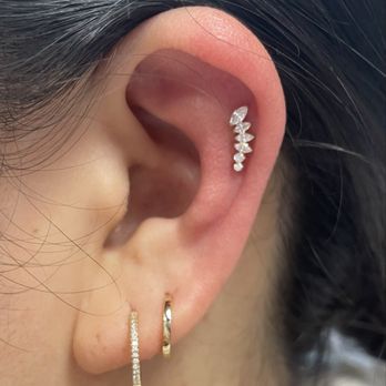 Red Rocket Tattoo - La Piercer (upper ear piercing) - Tattoo Near Me - New York, New York Red Rocket Tattoo - La Piercer (upper ear piercing) - Tattoo Near Me - New York, New York
