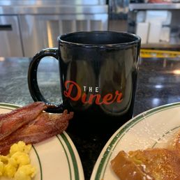 a breakfast of eggs, bacon and toast