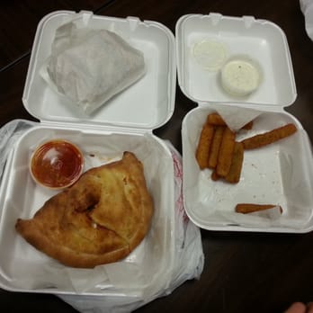 Fratelli's Pizza - Three Cheese Calzone and partially eaten Fried Zucchini. - Pizza Near Me - North Hills, California Fratelli's Pizza - Three Cheese Calzone and partially eaten Fried Zucchini. - Pizza Near Me - North Hills, California