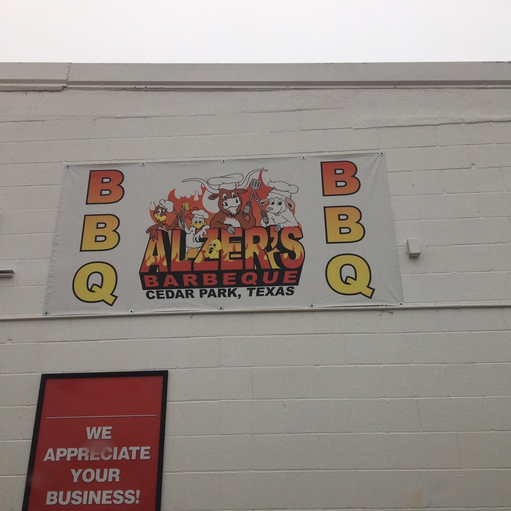 Alzer's BBQ - Sign on wall over truck - Barbeque Near Me - Cedar Park, Texas Alzer's BBQ - Sign on wall over truck - Barbeque Near Me - Cedar Park, Texas