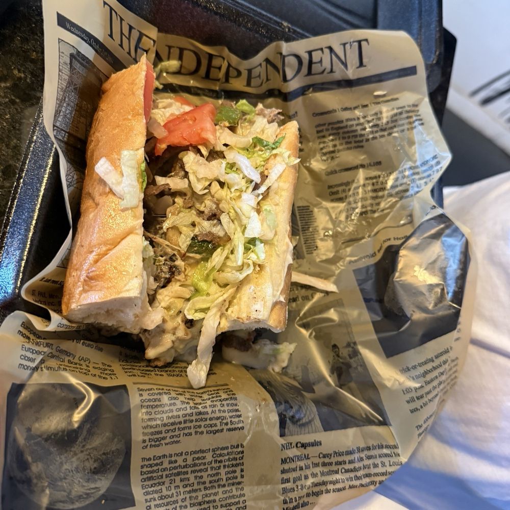 Philly cheesesteak half of the sandwich shared.