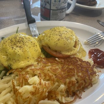 Christo's Cafe - Florentine Eggs Benedict on a biscuit with hash browns and wheat toasts with coffee - Breakfast & Brunch Near Me - Orlando, Florida Christo's Cafe - Florentine Eggs Benedict on a biscuit with hash browns and wheat toasts with coffee - Breakfast & Brunch Near Me - Orlando, Florida