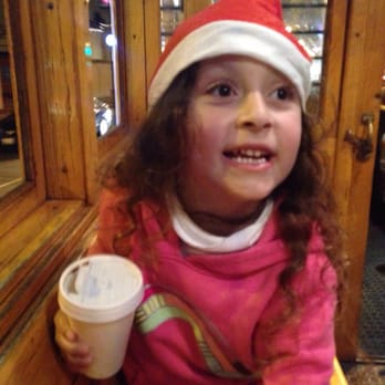 Big Red Bus - She loved her Santa hat and hot cocoa - Tours Near Me Big Red Bus - She loved her Santa hat and hot cocoa - Tours Near Me