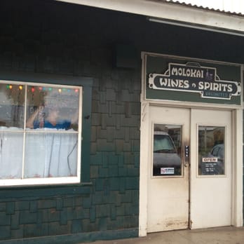 Molokai Wines & Spirits - Entryway and owner putting up Christmas lights. - Beer, Wine & Spirits Near Me - Kaunakakai, Hawaii Molokai Wines & Spirits - Entryway and owner putting up Christmas lights. - Beer, Wine & Spirits Near Me - Kaunakakai, Hawaii