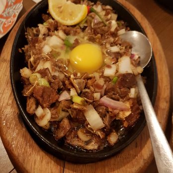 Kulinarya - Sisig - crispy pig ears! You mix the egg in for an overall creamy and crispy texture - Filipino Near Me - Vancouver, British Columbia