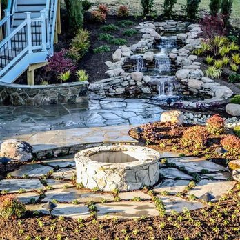 Outdoor Solutions - a water feature in a garden - Landscaping Near Me - Manassas, Virginia Outdoor Solutions - a water feature in a garden - Landscaping Near Me - Manassas, Virginia