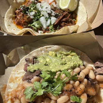 Corazon Cocina - Bottom: Norteño (carne asada, cheese, guac, beans, salsa mugrosa) top: Birria taco (braised short rib, salsa macha, onions, cilantro) - Mexican Near Me - Santa Barbara, California Corazon Cocina - Bottom: Norteño (carne asada, cheese, guac, beans, salsa mugrosa) top: Birria taco (braised short rib, salsa macha, onions, cilantro) - Mexican Near Me - Santa Barbara, California