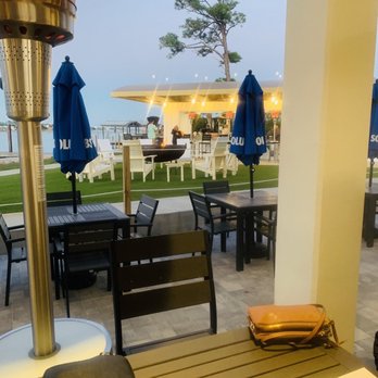 Zeke's Restaurant - Looking toward nice bar area with a fire pit. - Salad Near Me - Orange Beach, Alabama