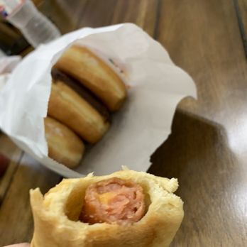 Friendly Donuts - a person holding a sandwich in their hand - Donuts Near Me - Houston, Texas Friendly Donuts - a person holding a sandwich in their hand - Donuts Near Me - Houston, Texas
