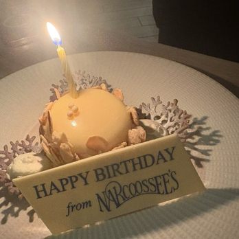 Narcoossee's - Birthday amazingness.   Almond-crusted Cheesecake - New American Near Me - Lake Buena Vista, Florida