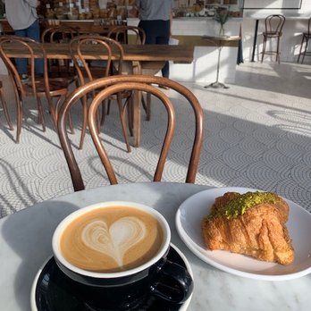 Tatte Bakery & Cafe | Coolidge Corner - Oat milk cappucino and pistachio croissant. - Coffee & Tea Near Me - Brookline, Massachusetts