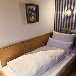 Hotel Goldener Greif - Bed in a single room. It's actually quite comfortable and the room is a good value.