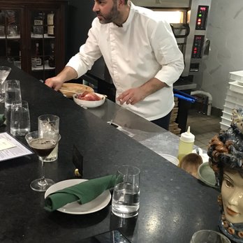 Strega - Chef prepares various dishes adjacent to the bar - Wine Bars Near Me - Milford, Connecticut