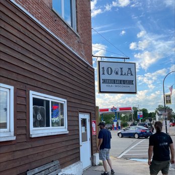 10 LA Corner Bar - two people walking down the sidewalk - Bars Near Me - Iola, Wisconsin