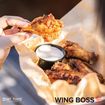 Wing Boss - a person holding a piece of chicken - Food Delivery Services Near Me - Rowlett, Texas Wing Boss - a person holding a piece of chicken - Food Delivery Services Near Me - Rowlett, Texas