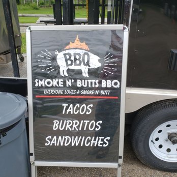 Smoke N’ Butts -  a sign for a bbq - Food Trucks Near Me