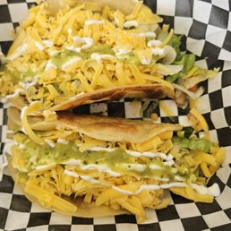 One ground beef taco and one mushroom taco. One ground beef taco and one mushroom taco.