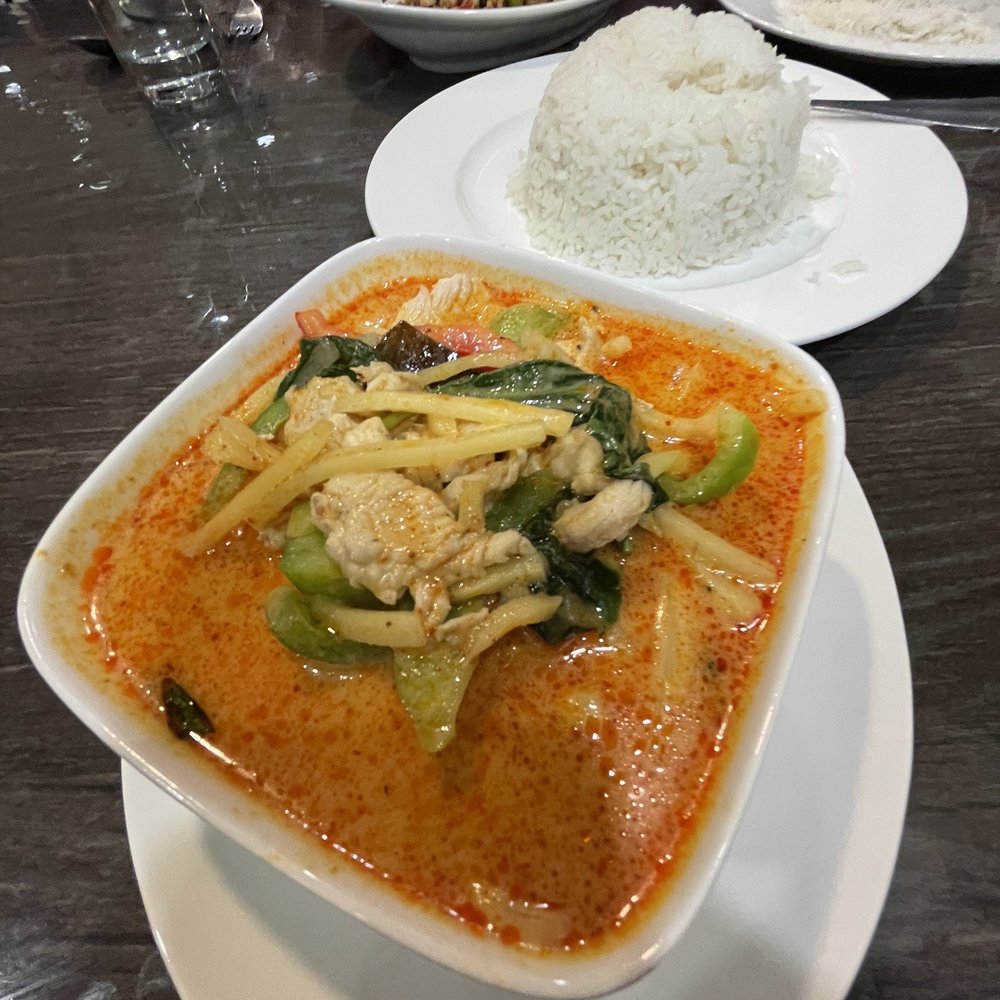 KC Thai - Red Curry with Chicken in the foreground and Gapow with chicken in the back. - Thai Near Me - Overland Park, Kansas KC Thai - Red Curry with Chicken in the foreground and Gapow with chicken in the back. - Thai Near Me - Overland Park, Kansas