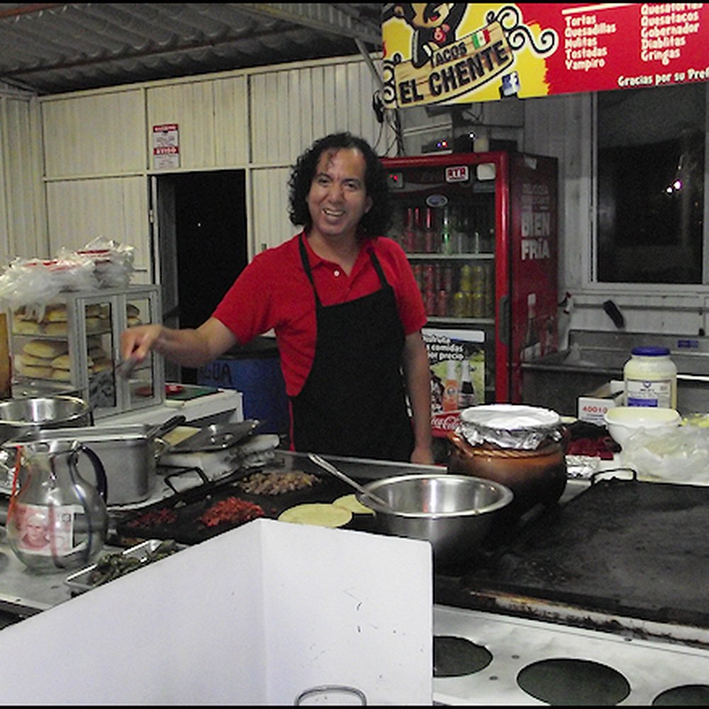 El Chente - Jim, who is very friendly, is cooking my tacos in the open kitchen. - Tacos Near Me - Ensenada, BCN El Chente - Jim, who is very friendly, is cooking my tacos in the open kitchen. - Tacos Near Me - Ensenada, BCN