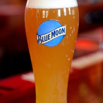 Joe's Saloon - a glass of beer on a table - Sports Bars Near Me - Brookfield, Illinois
