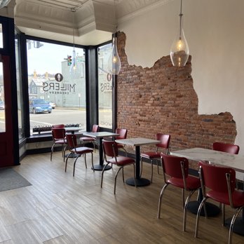Miller's Creamery - a brick wall and tables - Ice Cream & Frozen Yogurt Near Me - Dover, Ohio Miller's Creamery - a brick wall and tables - Ice Cream & Frozen Yogurt Near Me - Dover, Ohio