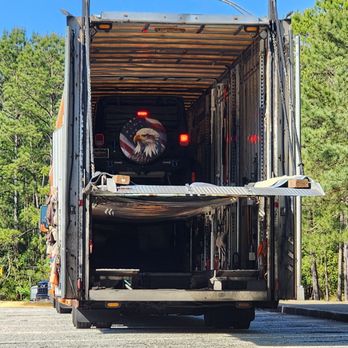 Reliable Carriers - Team of Bob and Lisa Pruden working to unload my vehicle. - Vehicle Shipping Near Me - Canton, Michigan