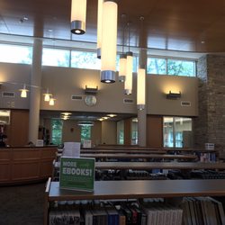 Center Moriches Free Public Library - Plenty of spots to sit, read and relax with a beautiful view of the front of the building.