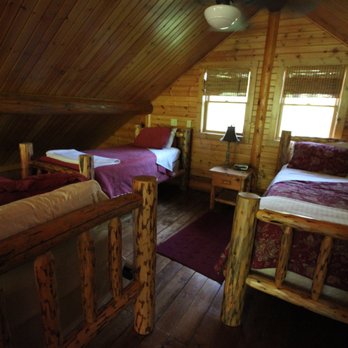 Grumpsters Cabins - Cabin 3's loft includes a queen bed and two twin beds. - Vacation Rentals Near Me - McGregor, Iowa