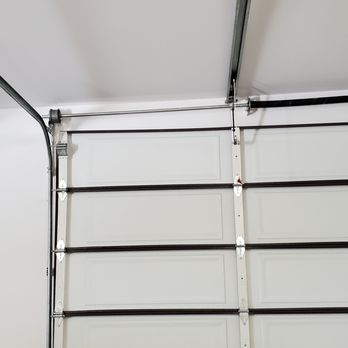 Mesa Garage Doors - The rod across the top is not mounted level. The door operates on cables. The door doesn't work when the cables don't wind in sync. - Garage Door Services Near Me - Anaheim, California Mesa Garage Doors - The rod across the top is not mounted level. The door operates on cables. The door doesn't work when the cables don't wind in sync. - Garage Door Services Near Me - Anaheim, California